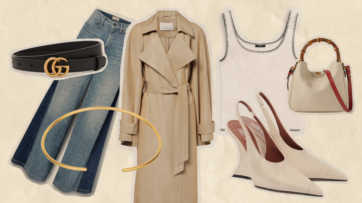 Milan Fashion Week street style outfit featuring a trench coat, jeans, heels, belt, and handbag.