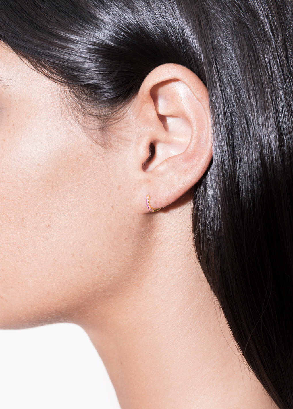 model wearing cate hoop 18k rubi