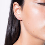 model wearing diamond floating earrings 18k