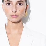 model wearing bia earrings and mini bia earrings in gold