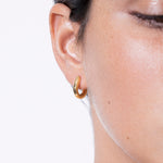 model wearing elise huggies in gold
