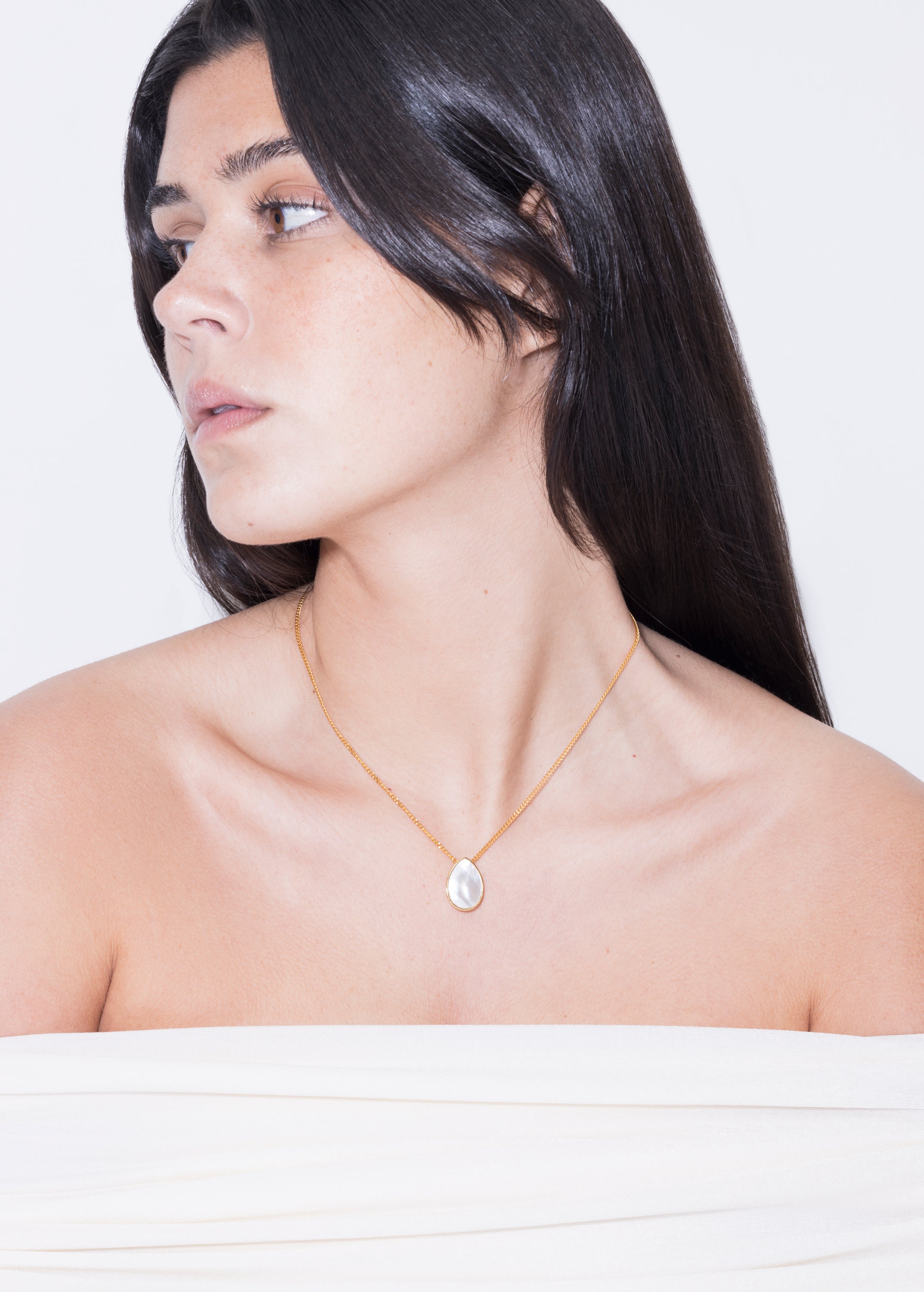 model wearing klein necklace in gold